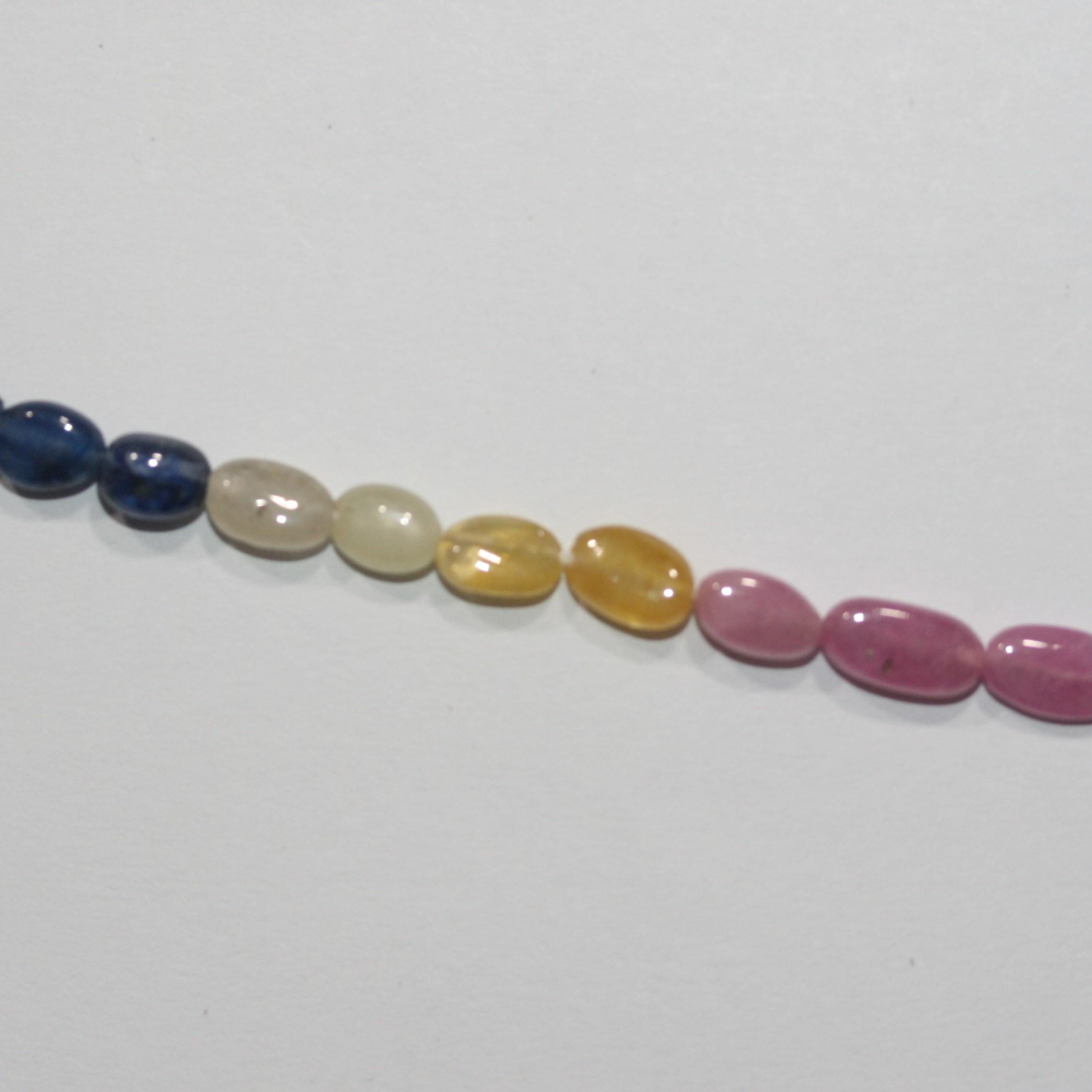 Cuentas ovaladas lisas de zafiro multicapa de 16" (7 x 5 mm). Longitud aproximada: 40 cm.