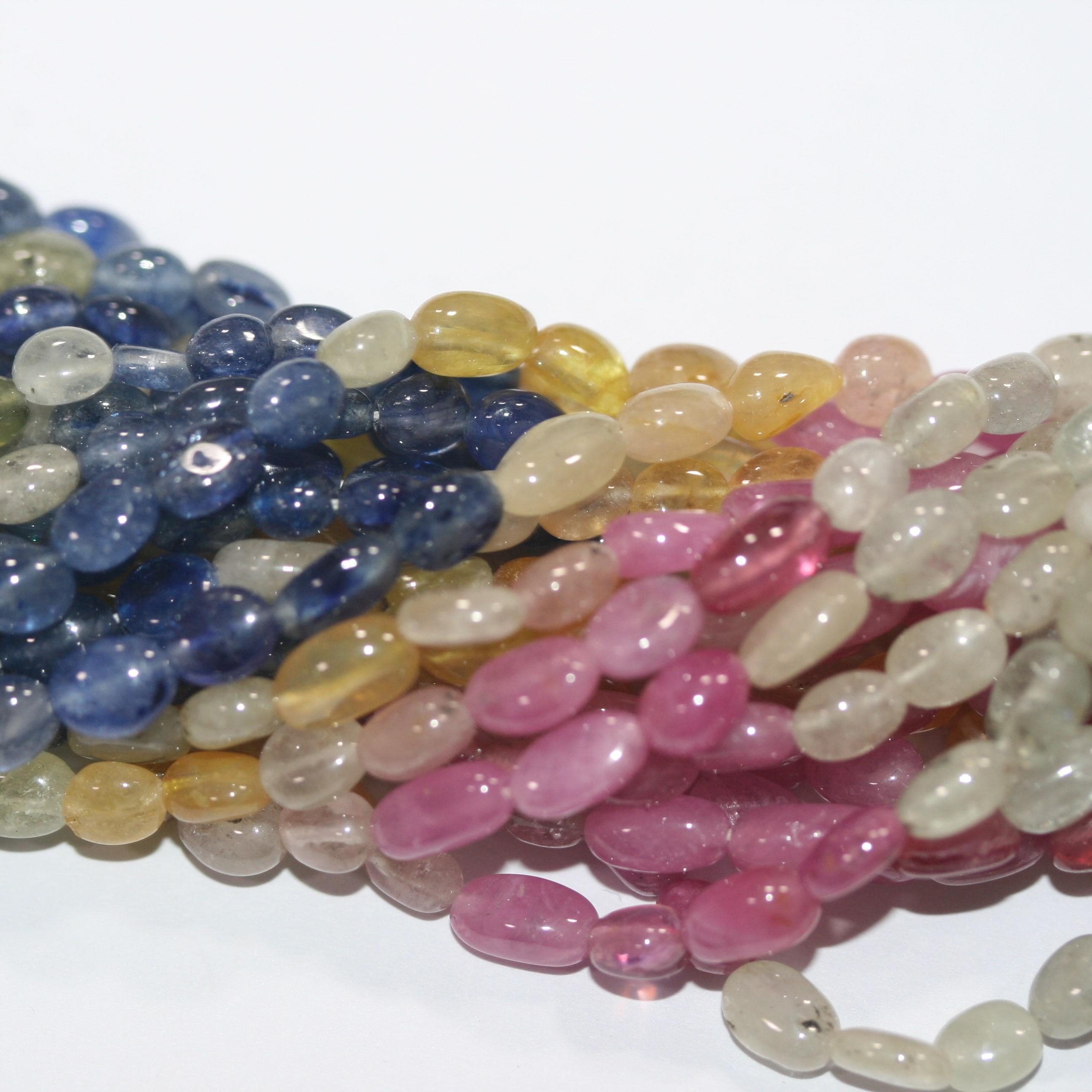 Cuentas ovaladas lisas de zafiro multicapa de 16" (7 x 5 mm). Longitud aproximada: 40 cm.