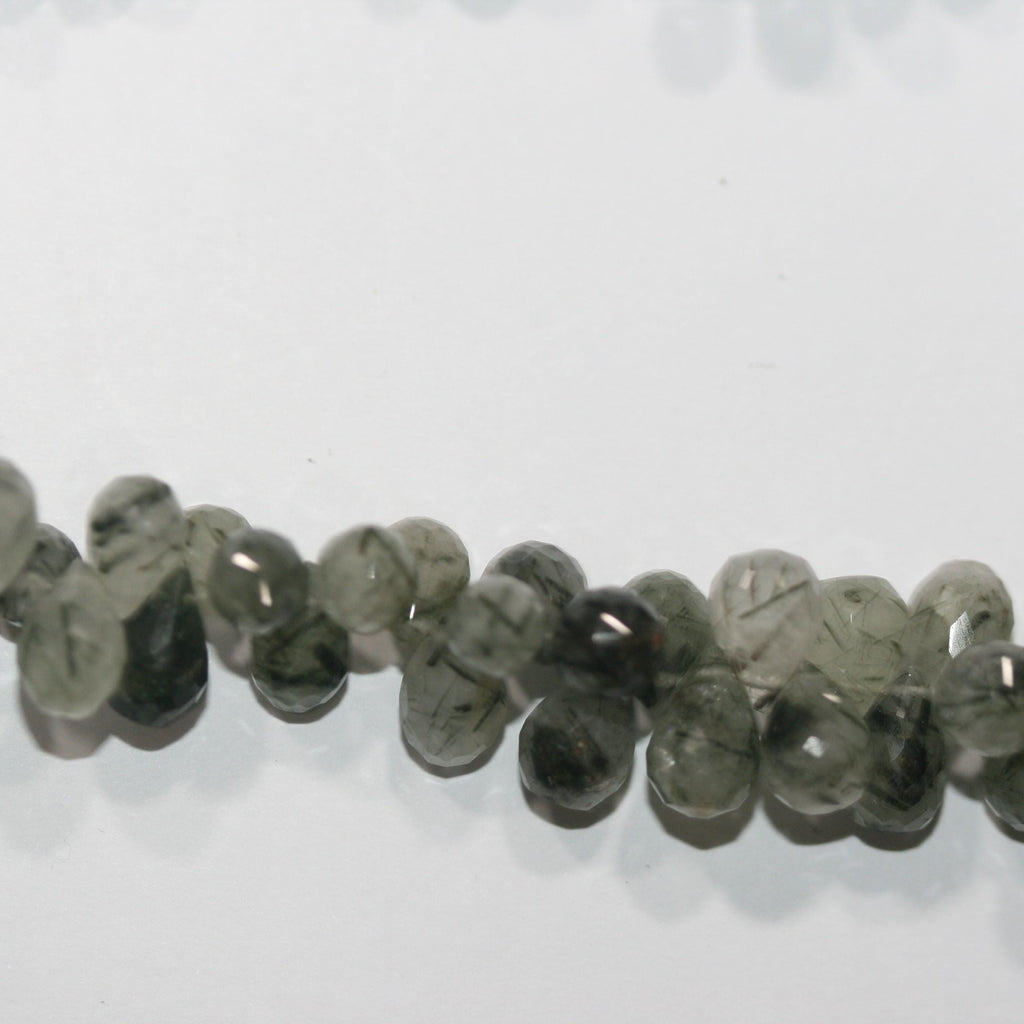 Cuentas facetadas de cuarzo rutilado verde de 8" (7 x 5 mm). Aprox. - Hilo de 20 cm. - Artículo 15040