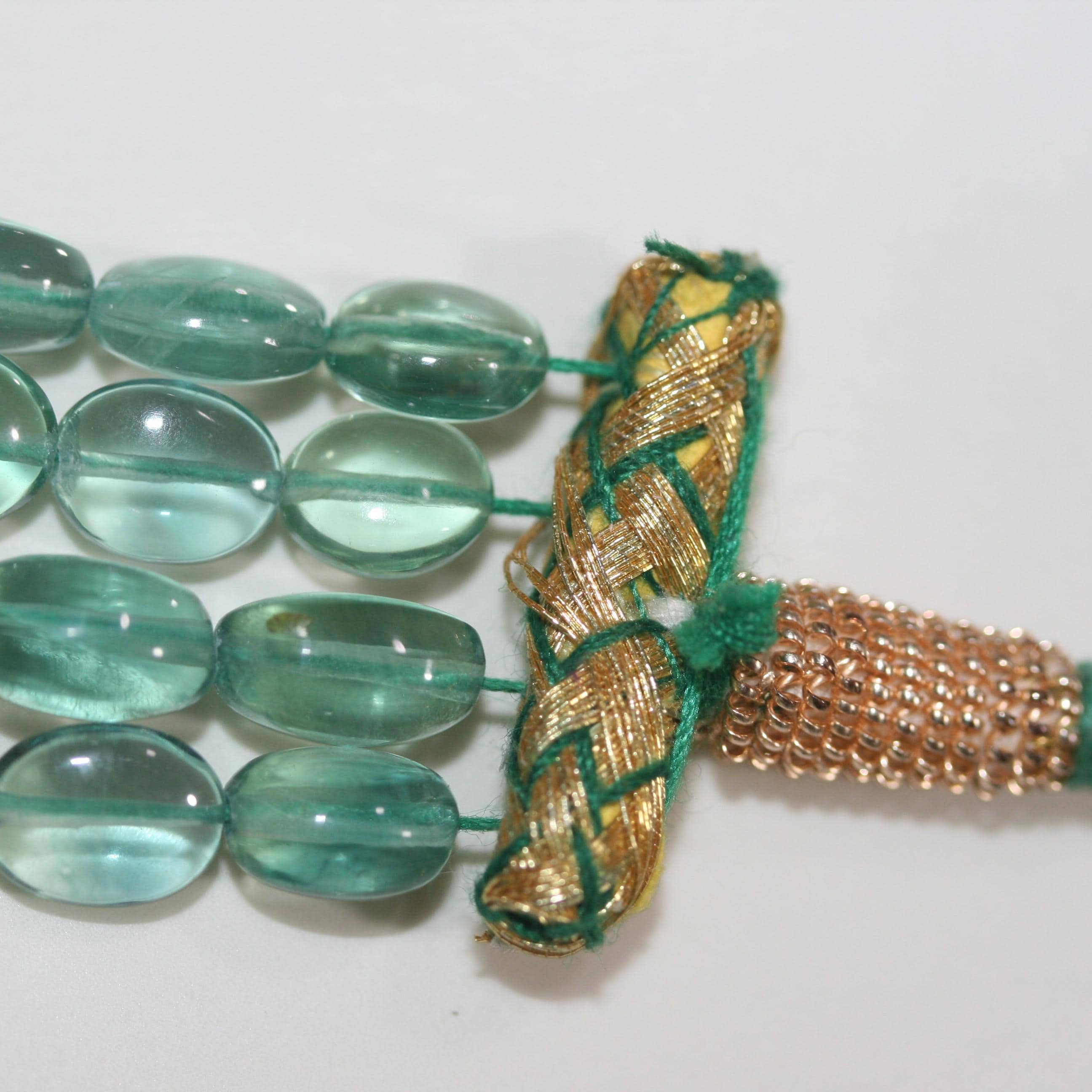 Collier ovale lisse dégradé en fluorite verte, 14 x 12 mm - 7,5 x 6 mm environ (4 rangs) - Réf. 15072