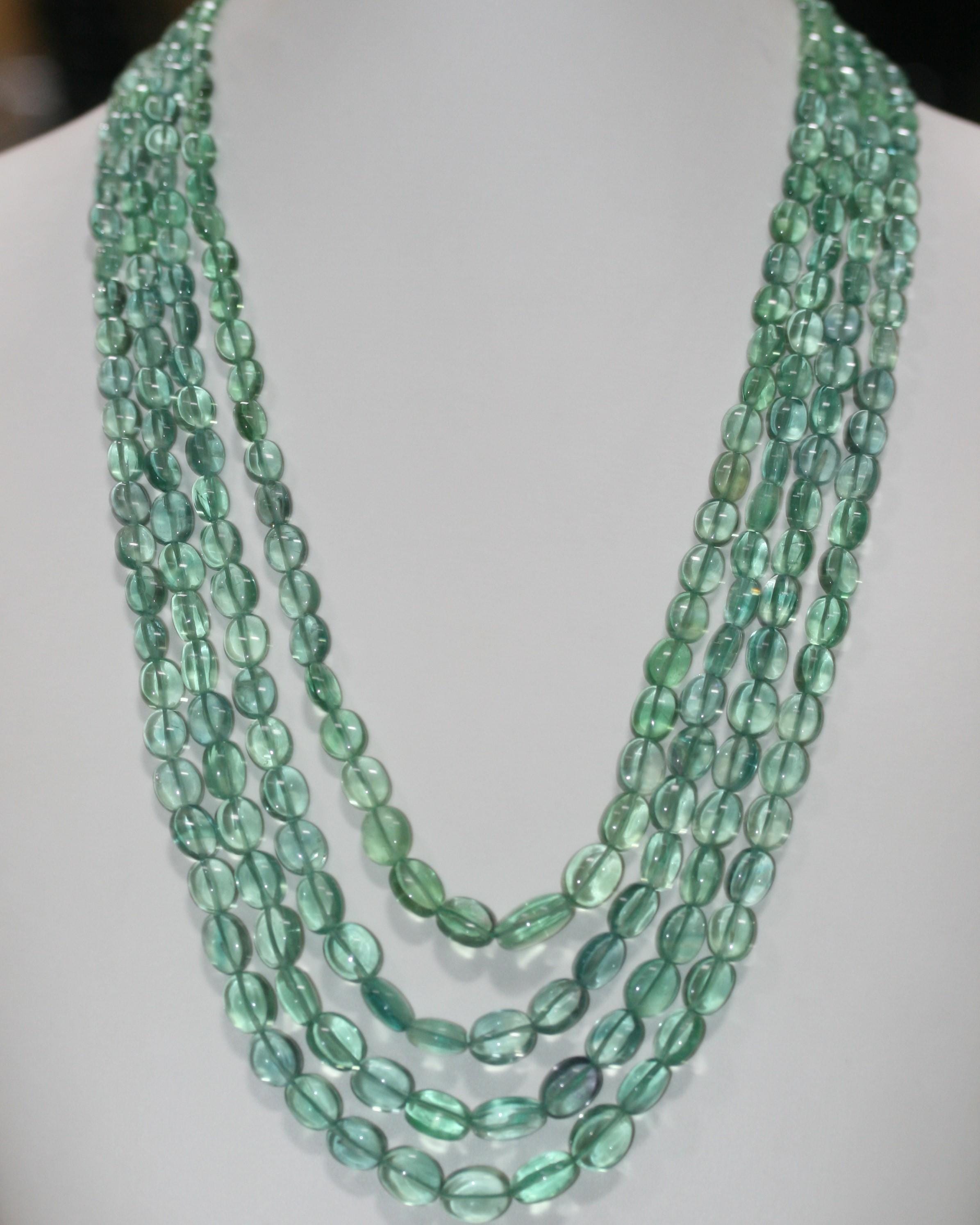 Collier ovale lisse dégradé en fluorite verte, 11 x 9 à 7 x 5 mm environ (4 rangs) - Réf. 15073