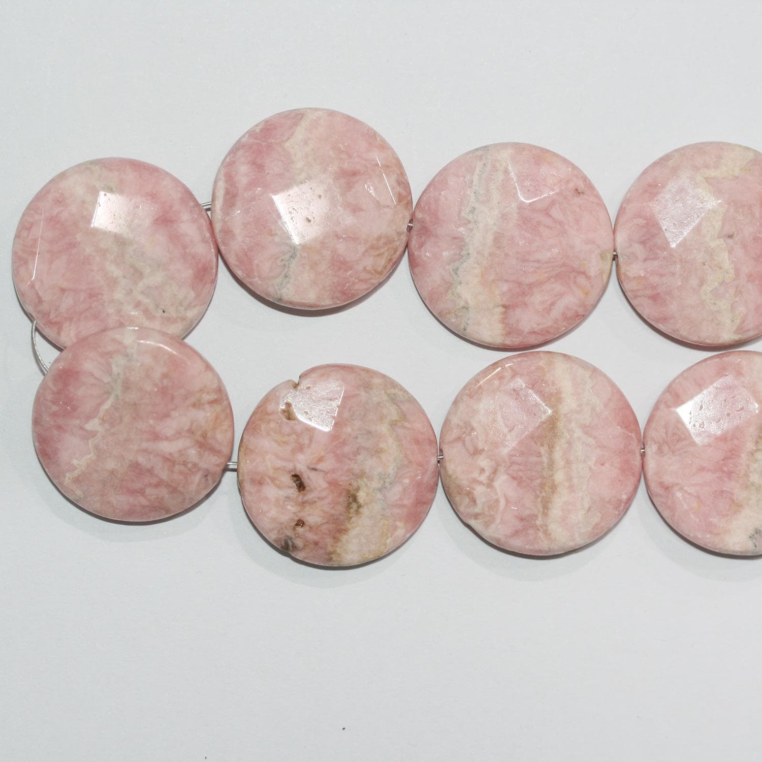 13" St Rhodochrosite Faceted coin Beads 25mm.-Strand 35cm.