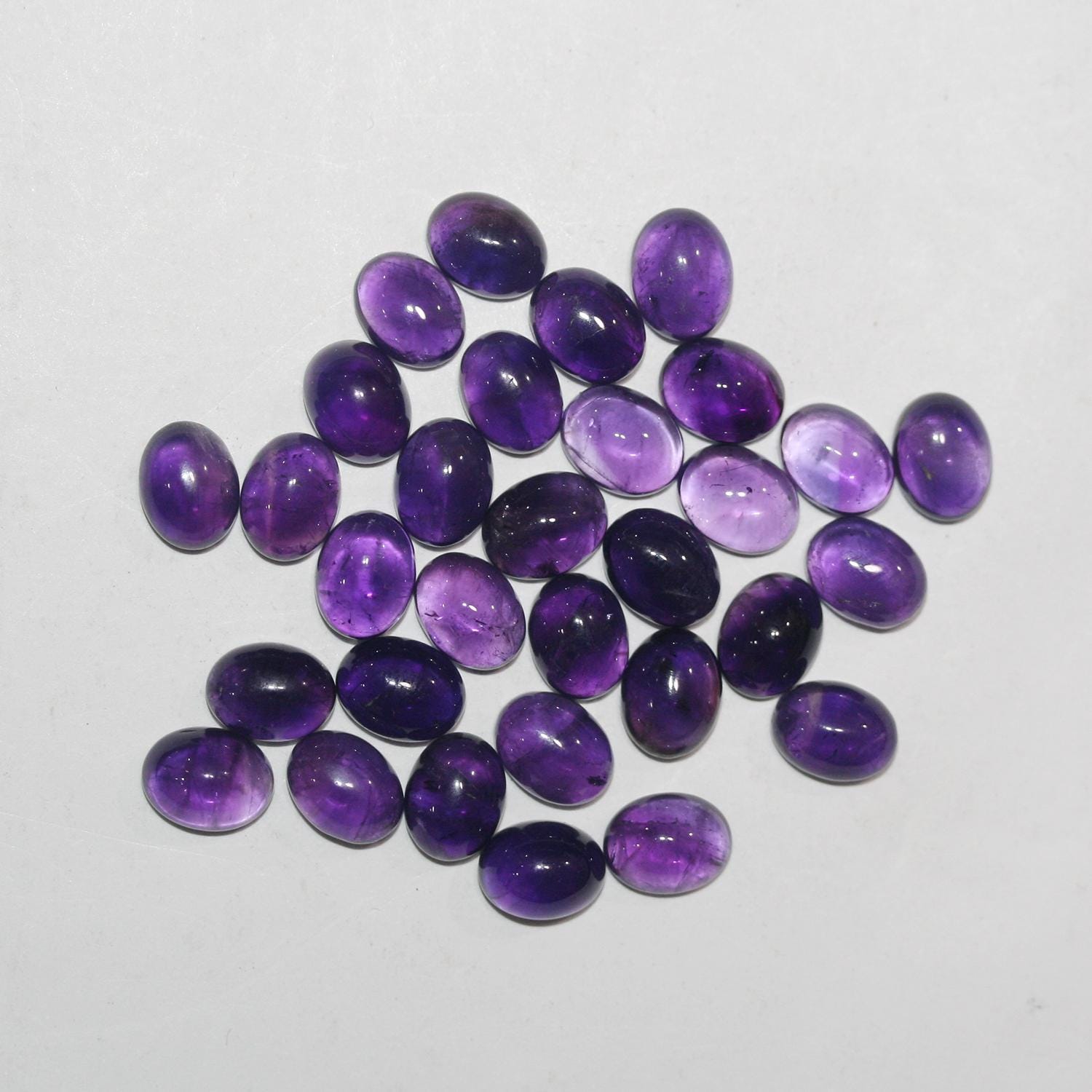 12 Pcs Lot Amethyst Oval Cabochon 9x7mm. (12 pcs.)