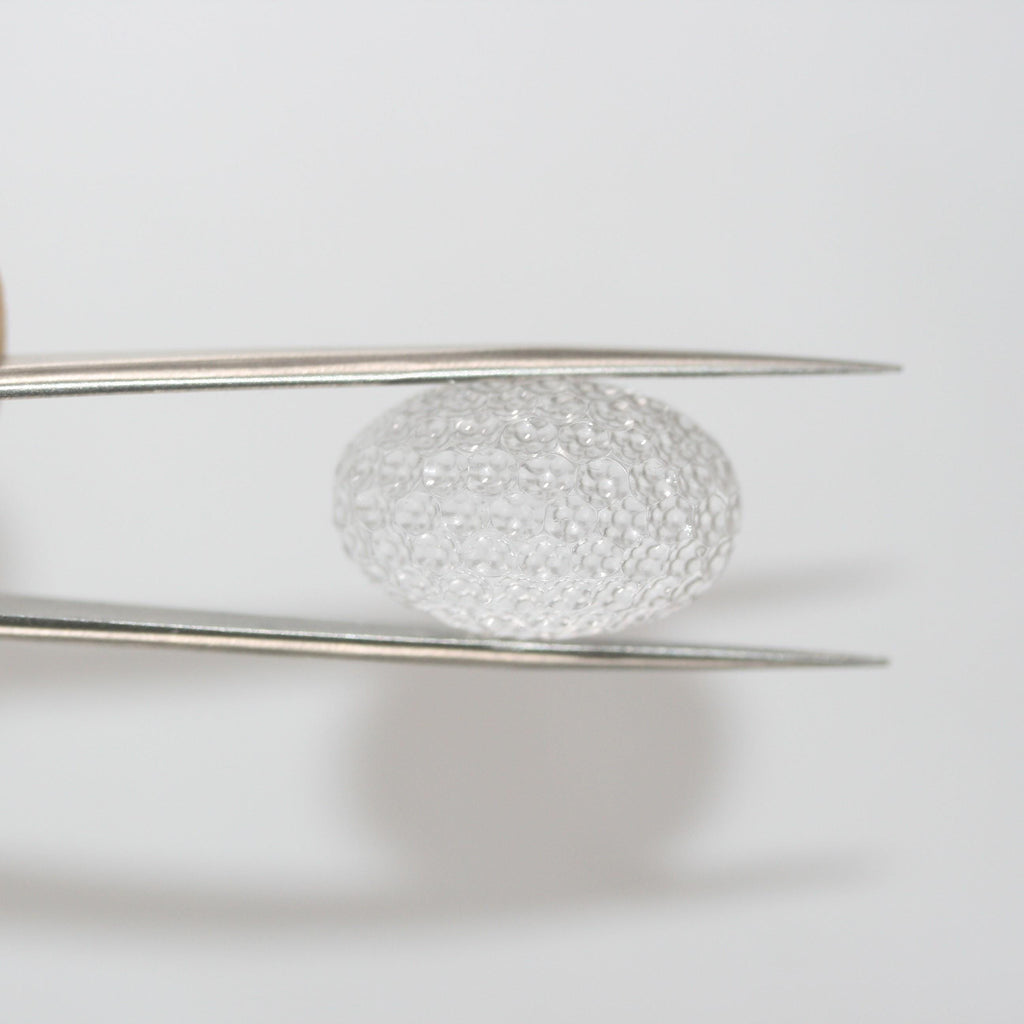 Quartz cristal de roche ovale avec cabochon en nid d'abeille 23,3 x 15 mm. (29,13 ct).