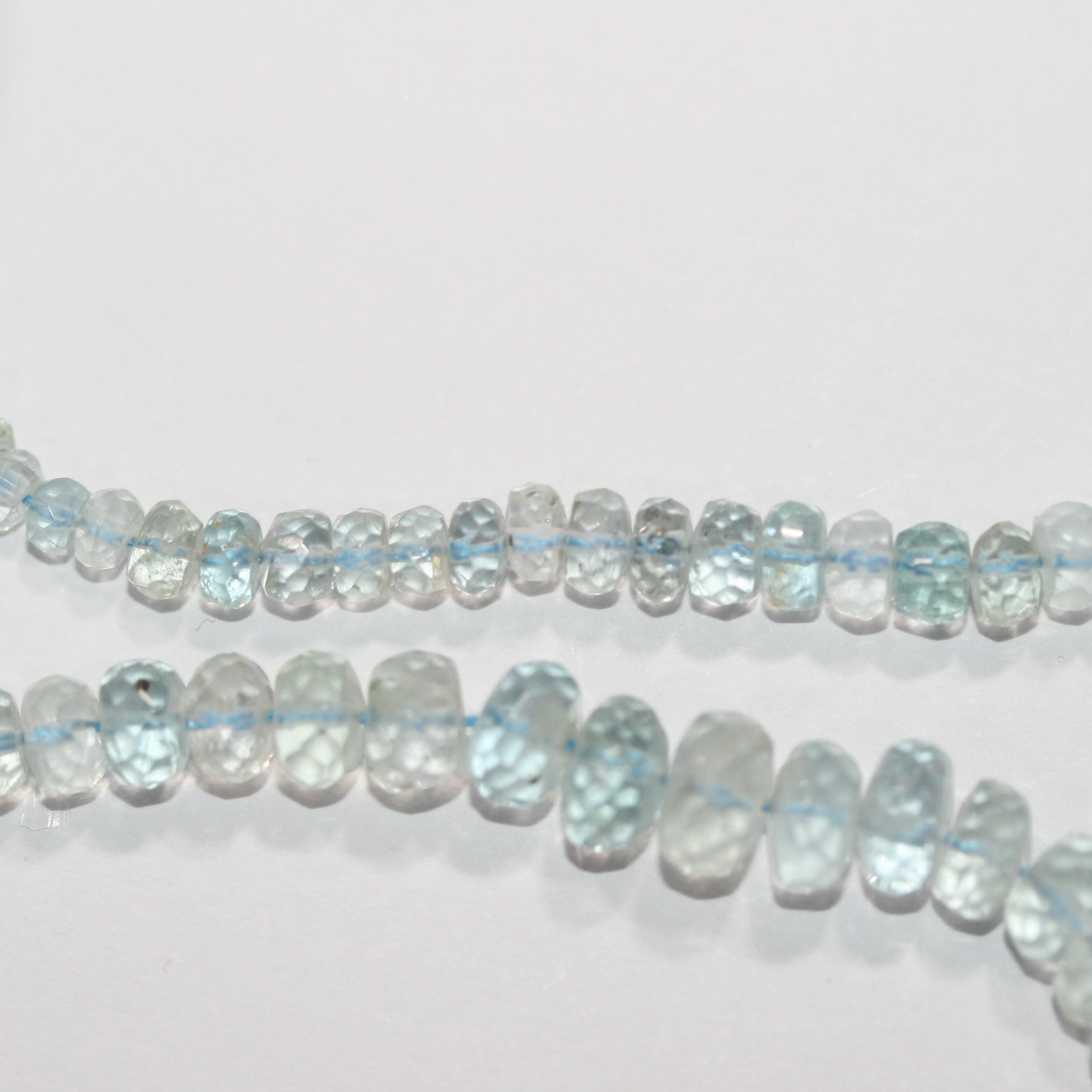 Cuentas redondas facetadas de aguamarina de 40 cm, graduadas, de 6,5 x 5-4 x 2 mm. Aprox. - Hilo de 40 cm - Artículo 15043