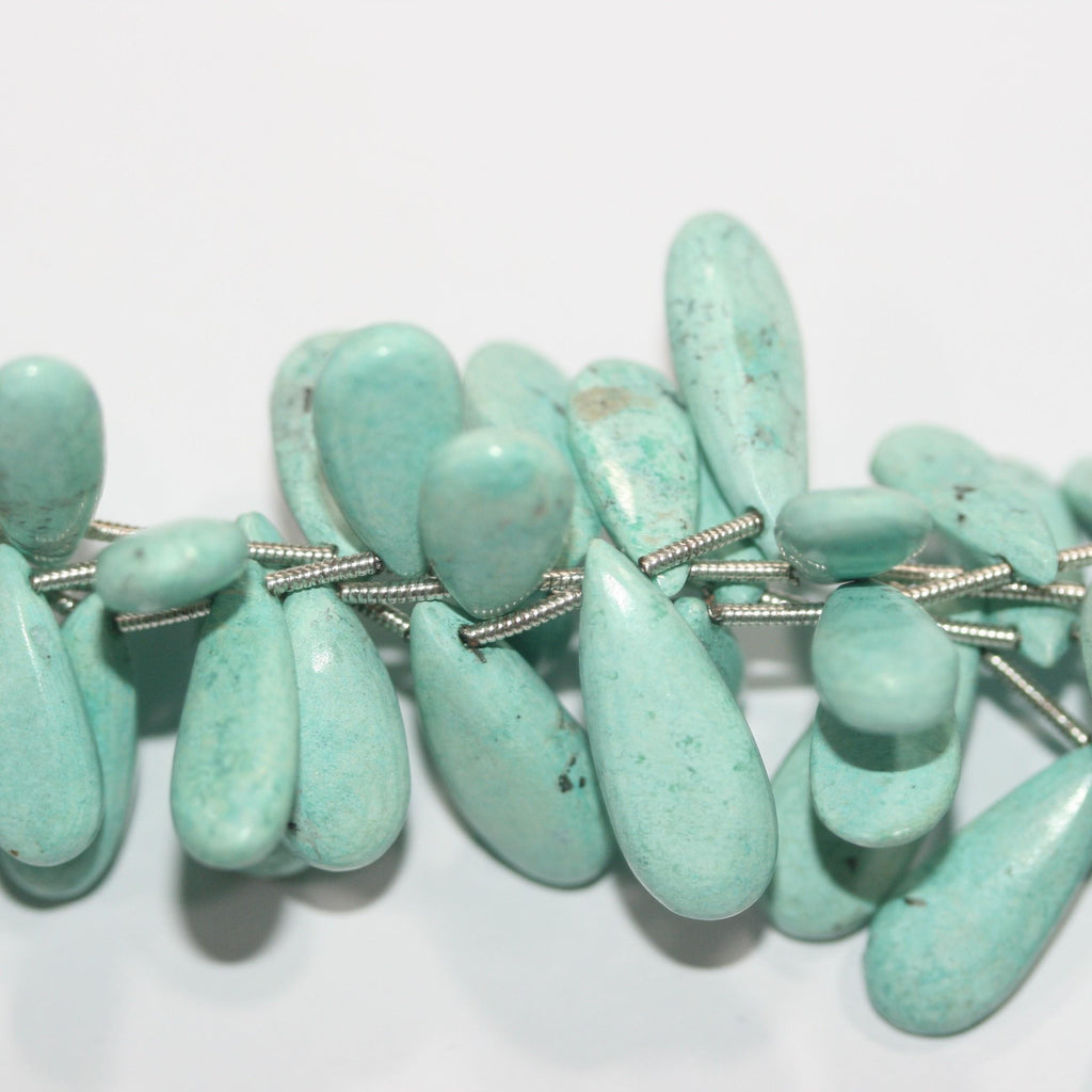 Perles plates lisses en turquoise St de 8 pouces (18 x 8 mm). Longueur du fil : environ 20 cm.