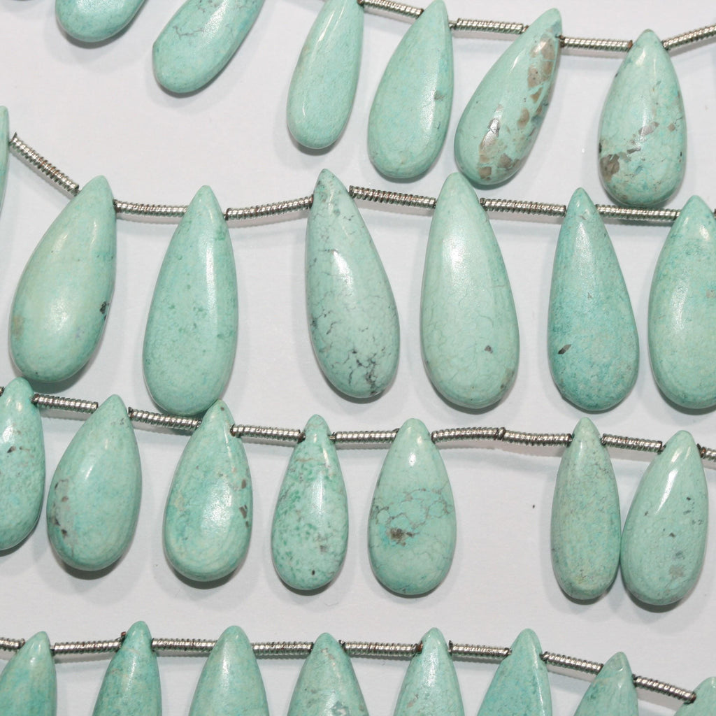 Perles plates lisses en turquoise St de 8 pouces (18 x 8 mm). Longueur du fil : environ 20 cm.