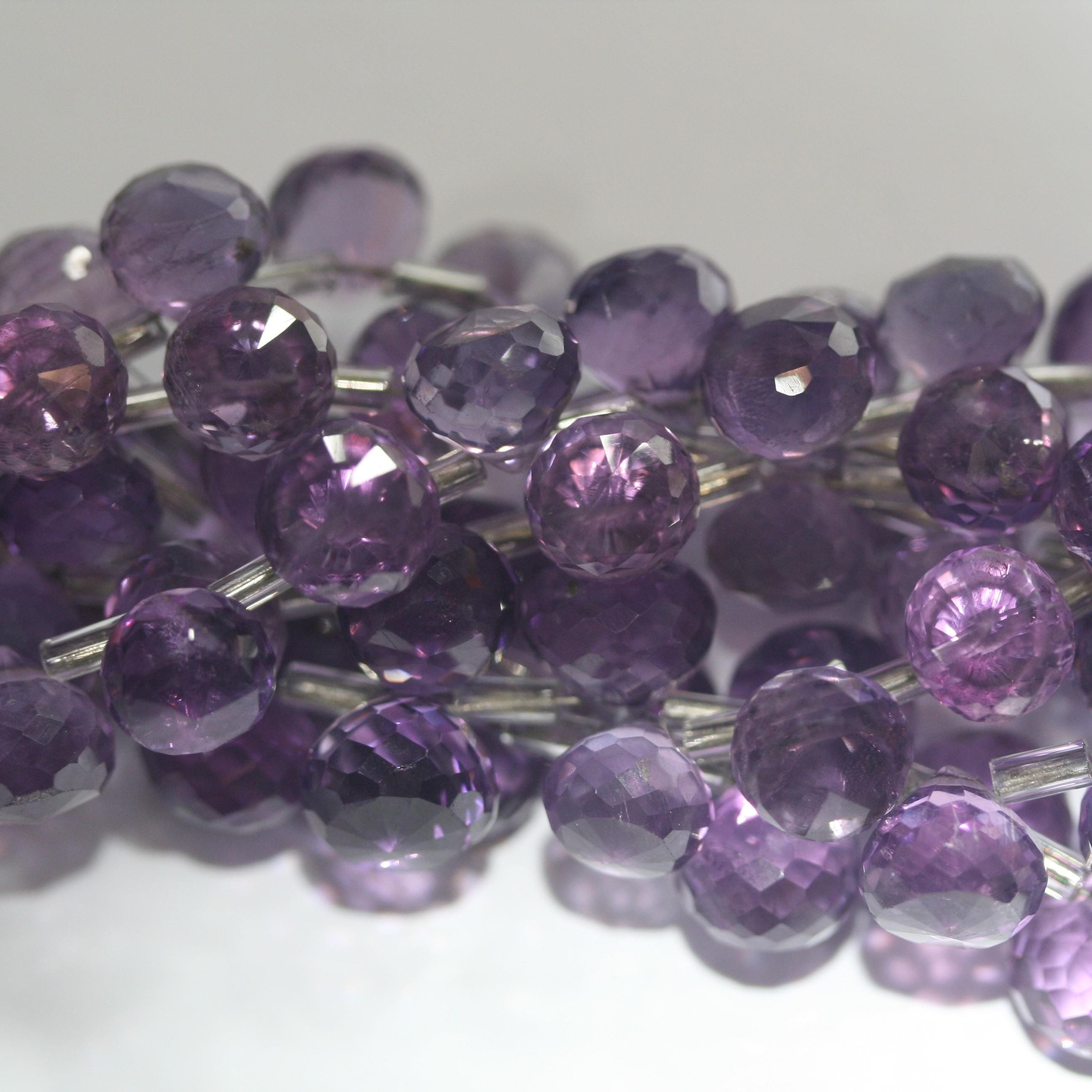 Cuentas de amatista facetadas de 8" (8-9 mm). Hilo de 20 cm aprox.