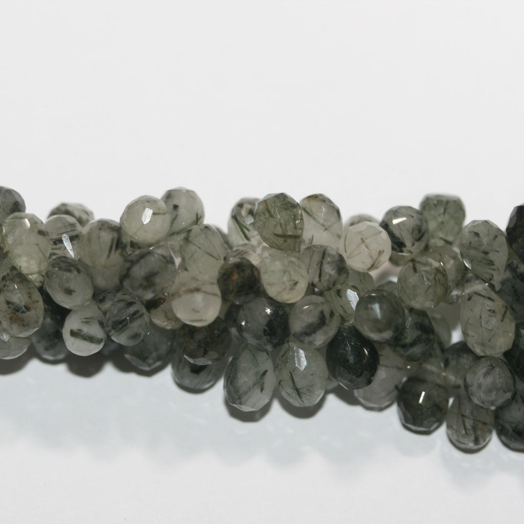 Cuentas facetadas de cuarzo rutilado verde de 8" (7 x 5 mm). Aprox. - Hilo de 20 cm. - Artículo 15040