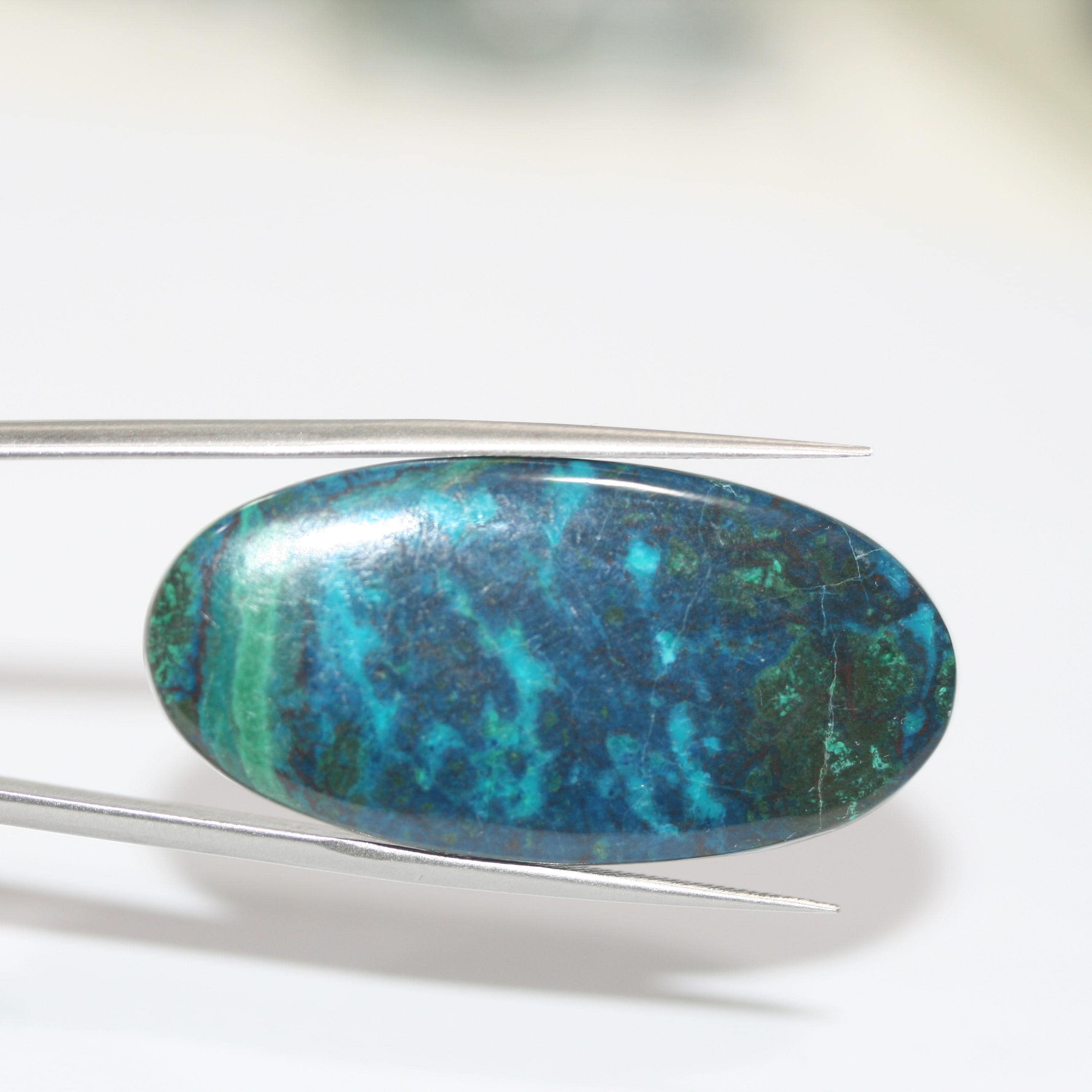 Cabochon ovale lisse en chrysocolle-shattuckite 40x20mm. (35,79 ct.)