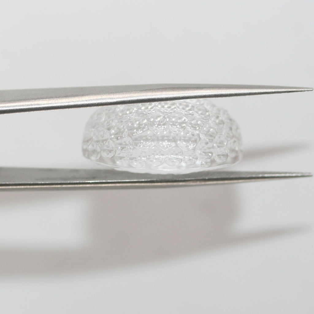 Quartz cristal de roche ovale avec cabochon en nid d'abeille 23,3 x 15 mm. (29,13 ct).